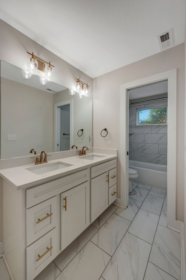 full bathroom featuring double vanity, visible vents, toilet, marble finish floor, and a sink