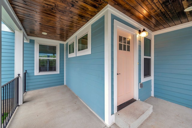 view of exterior entry featuring a porch