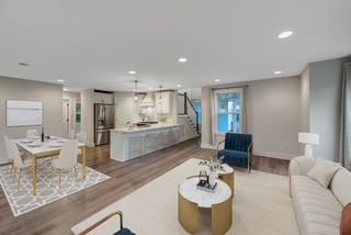 living area featuring stairs, dark wood-type flooring, and recessed lighting