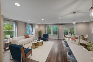 living room featuring recessed lighting, french doors, and wood finished floors