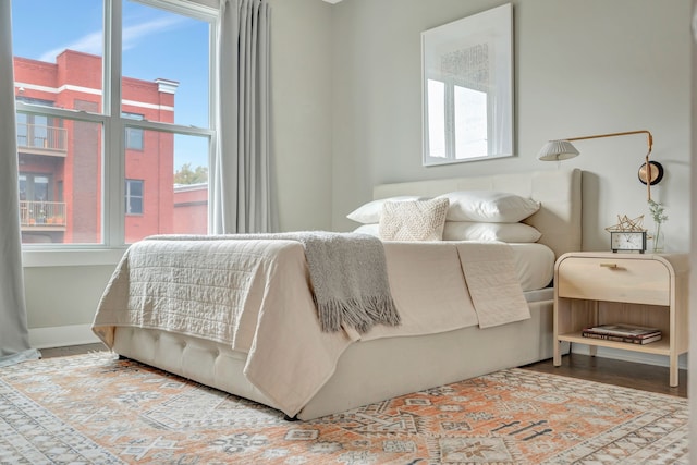 bedroom with hardwood / wood-style floors