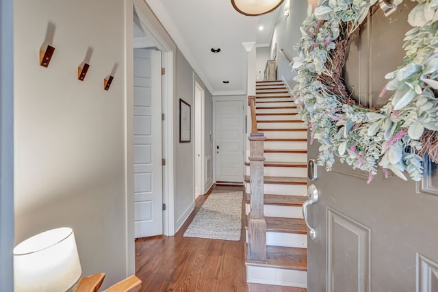 staircase with hardwood / wood-style flooring