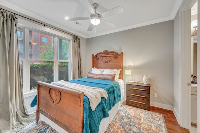 bedroom featuring ceiling fan, light wood-type flooring, and ornamental molding