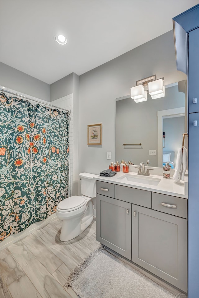 bathroom with vanity and toilet