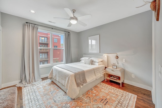 bedroom featuring hardwood / wood-style floors and ceiling fan