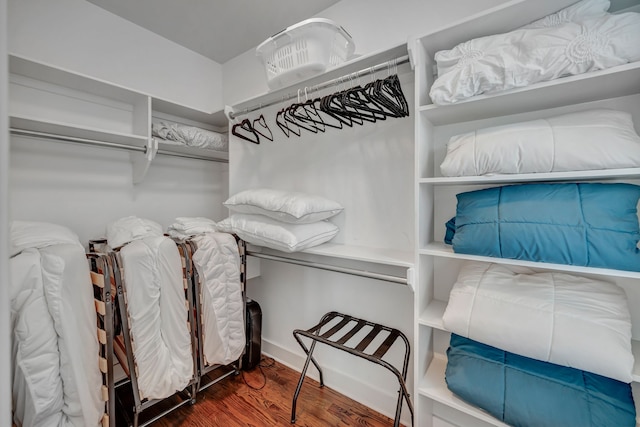 walk in closet featuring dark wood-type flooring