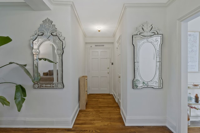 hallway featuring wood-type flooring and ornamental molding