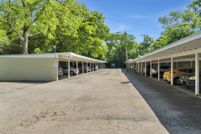 view of vehicle parking with a carport