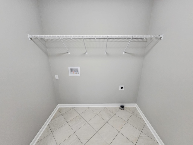 washroom featuring hookup for an electric dryer, tile patterned flooring, and hookup for a washing machine