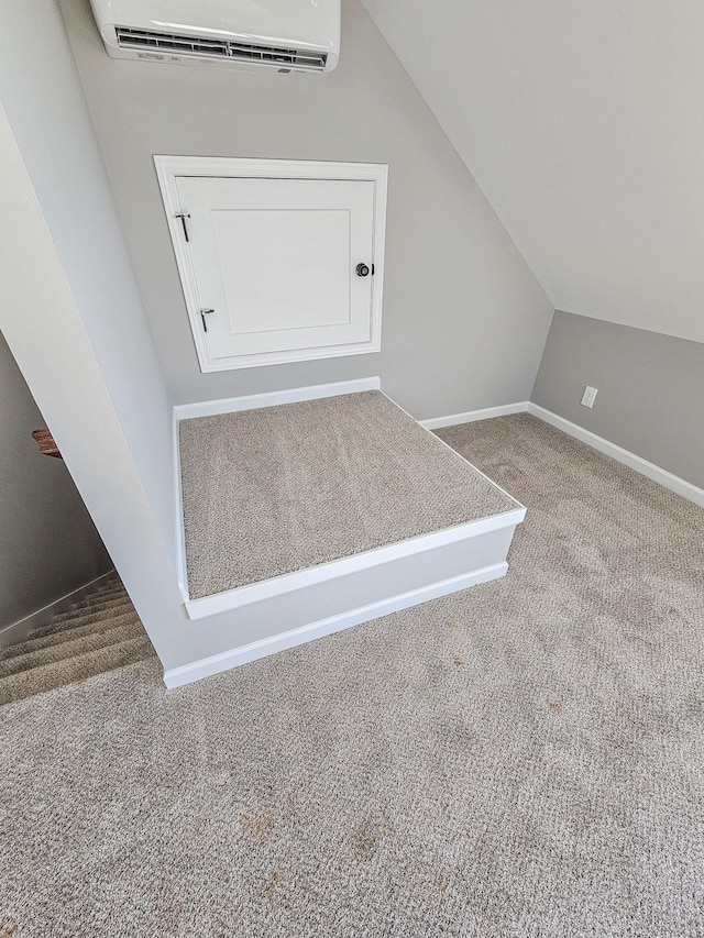 interior details with an AC wall unit and carpet