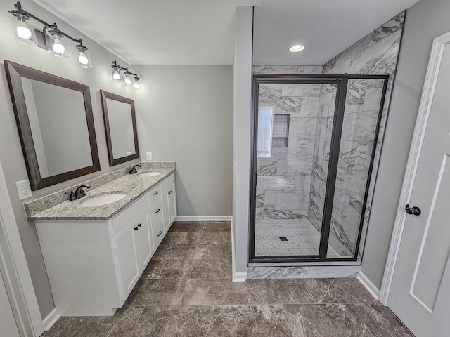 bathroom featuring vanity and an enclosed shower