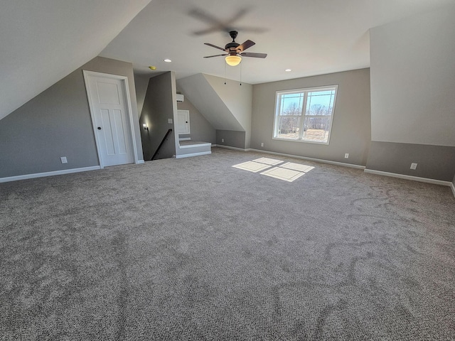 bonus room featuring lofted ceiling, carpet floors, and ceiling fan