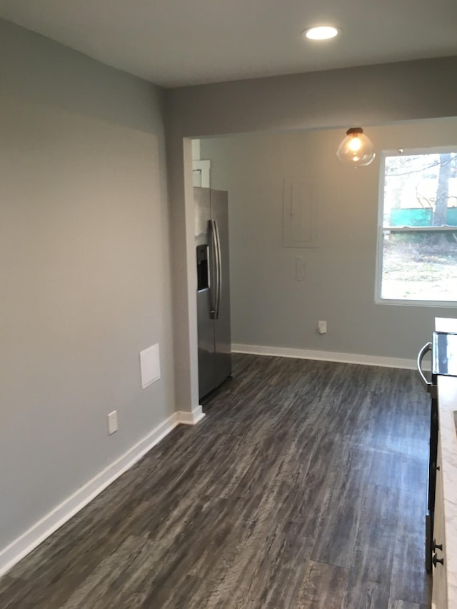 spare room featuring dark hardwood / wood-style flooring