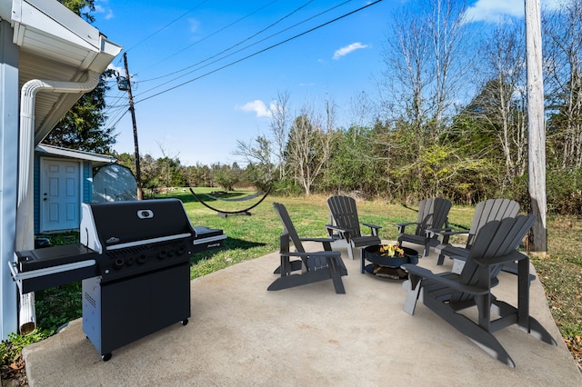 view of patio / terrace featuring grilling area and an outdoor fire pit