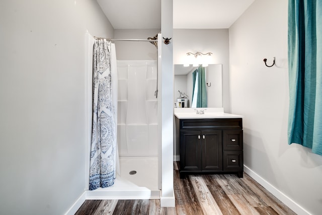 bathroom with vanity, wood-type flooring, and a shower with shower curtain