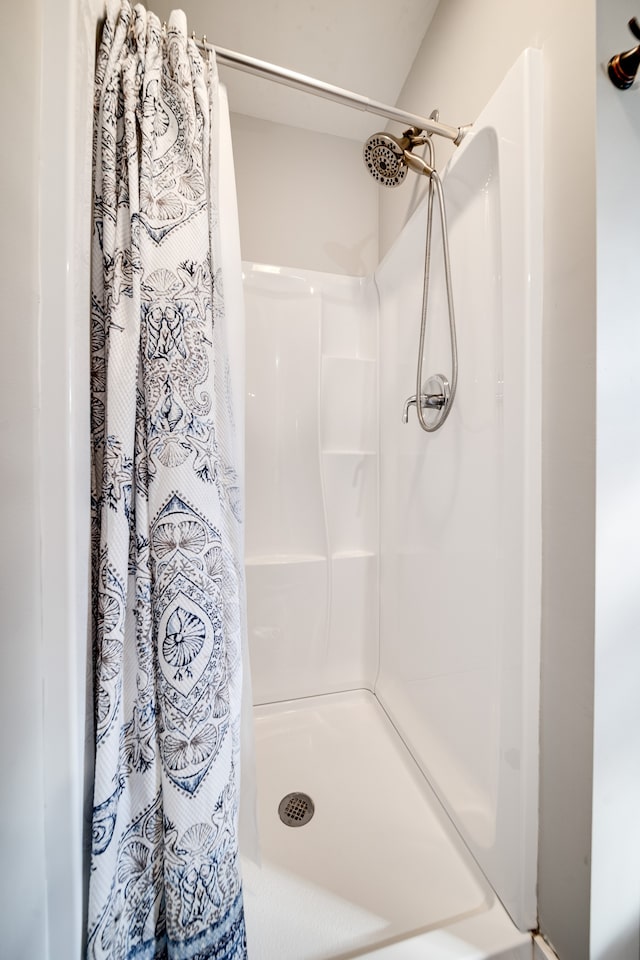 bathroom featuring walk in shower