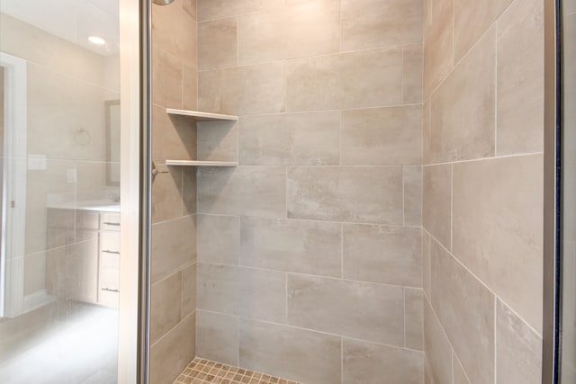 bathroom with a shower with shower door