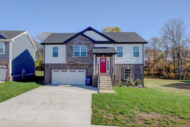 view of front of property featuring a garage and a front lawn