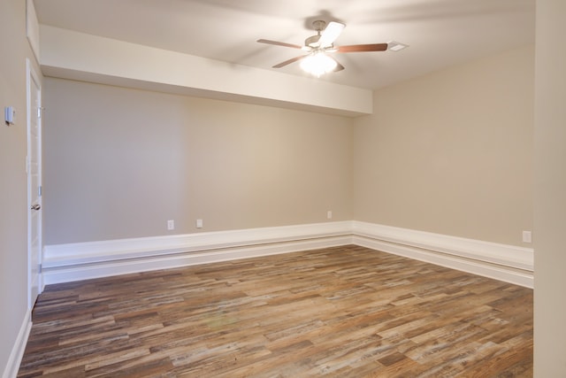 spare room featuring ceiling fan and wood-type flooring