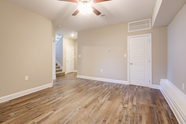 unfurnished room featuring ceiling fan and hardwood / wood-style flooring