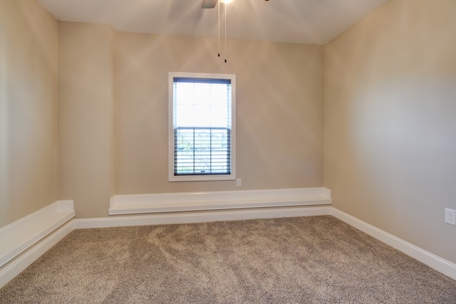 carpeted empty room featuring ceiling fan