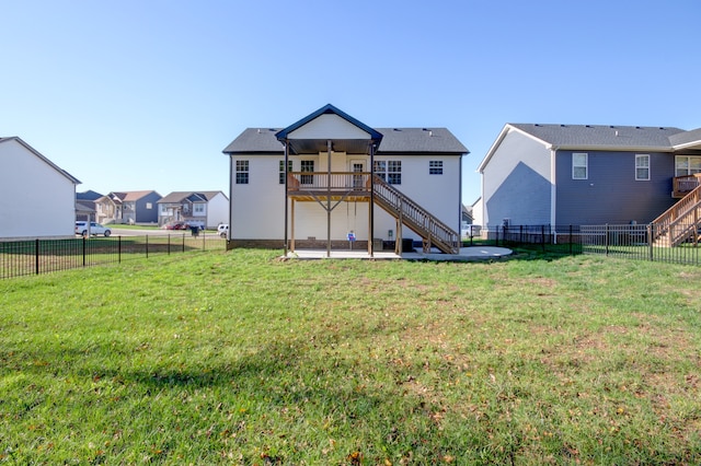 back of house with a yard, a patio, ceiling fan, and a wooden deck