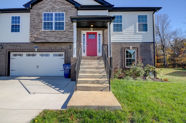 view of front of home featuring a garage and a front lawn