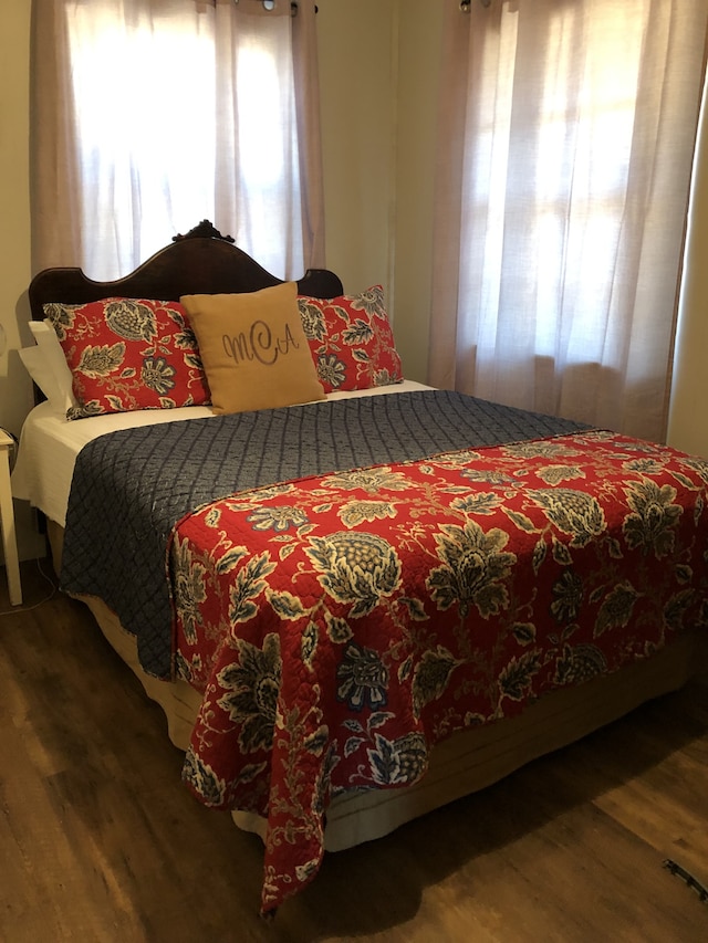 bedroom with wood-type flooring