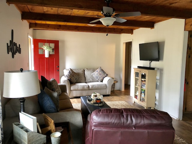 living room with hardwood / wood-style floors, beam ceiling, and wood ceiling