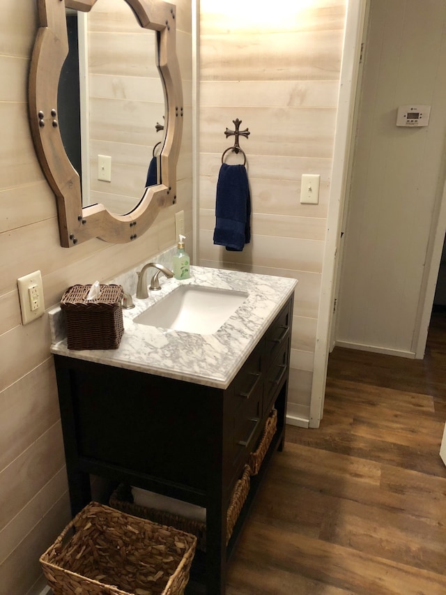 bathroom with vanity and hardwood / wood-style flooring