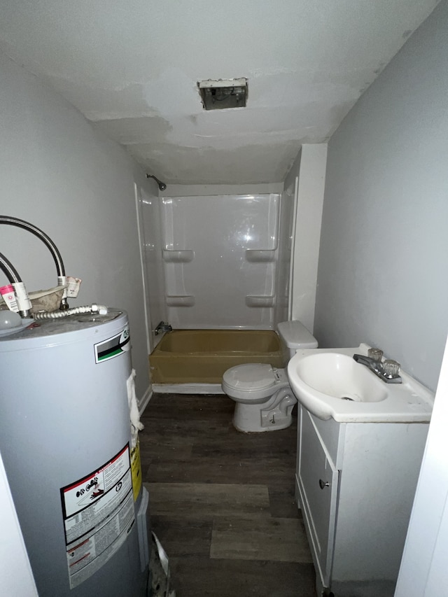 full bathroom with water heater, tub / shower combination, wood-type flooring, toilet, and vanity