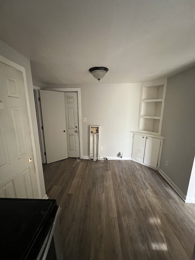 interior space featuring dark hardwood / wood-style floors and built in features