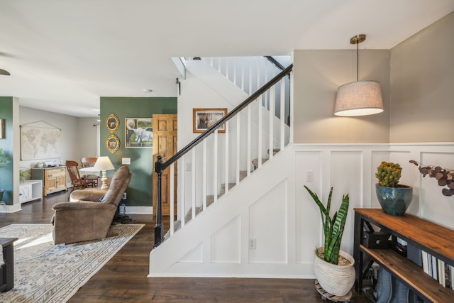 staircase featuring wood-type flooring