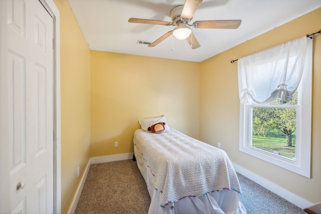 carpeted bedroom featuring ceiling fan