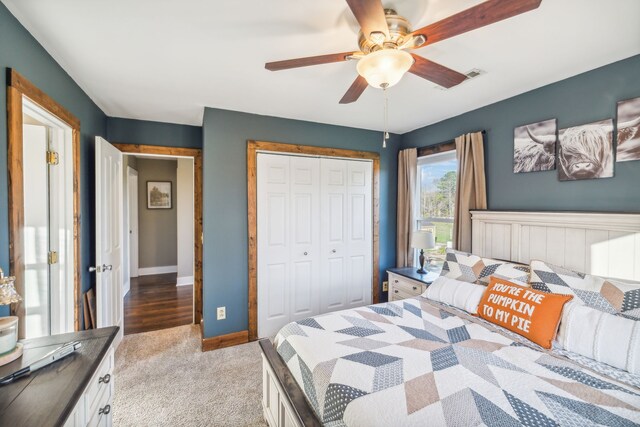 carpeted bedroom featuring ceiling fan and a closet