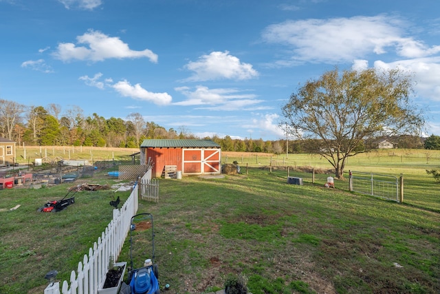 view of yard with a rural view and an outdoor structure