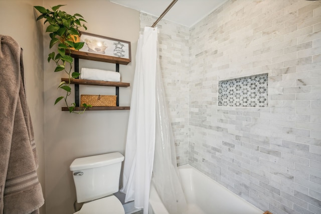 bathroom with shower / tub combo with curtain and toilet