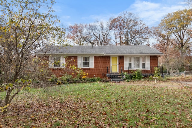 ranch-style house featuring a front lawn