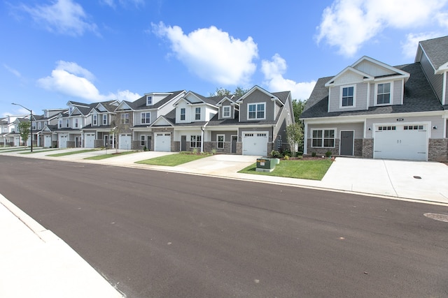 multi unit property featuring central AC unit and a garage