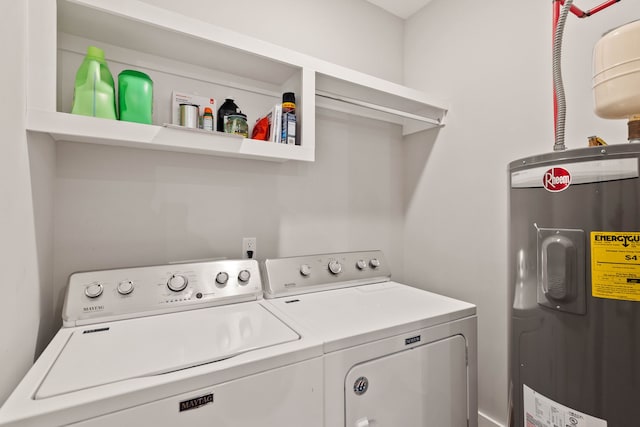 washroom featuring washing machine and clothes dryer and water heater