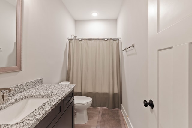 full bathroom with shower / tub combo, vanity, toilet, and tile patterned floors