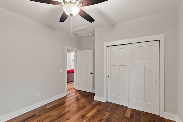 unfurnished bedroom featuring ceiling fan, a closet, and dark hardwood / wood-style floors