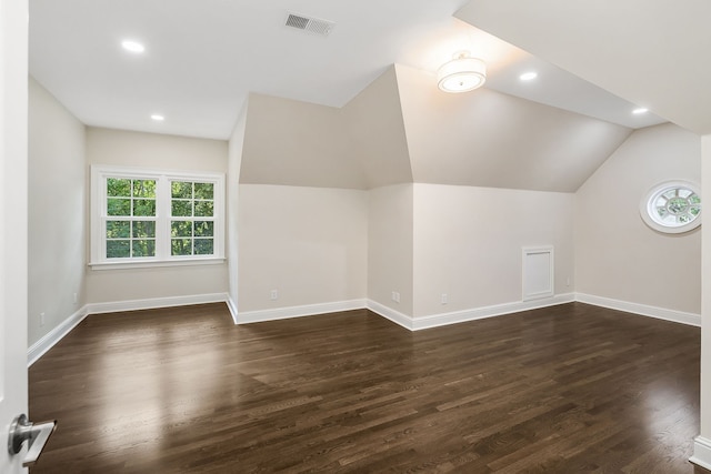 bonus room featuring lofted ceiling and dark wood-type flooring