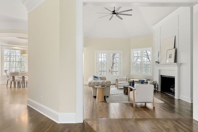 living room featuring lofted ceiling, a wealth of natural light, dark wood-type flooring, and ceiling fan