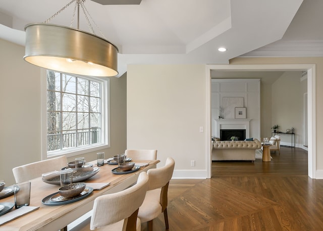 dining area with dark hardwood / wood-style flooring