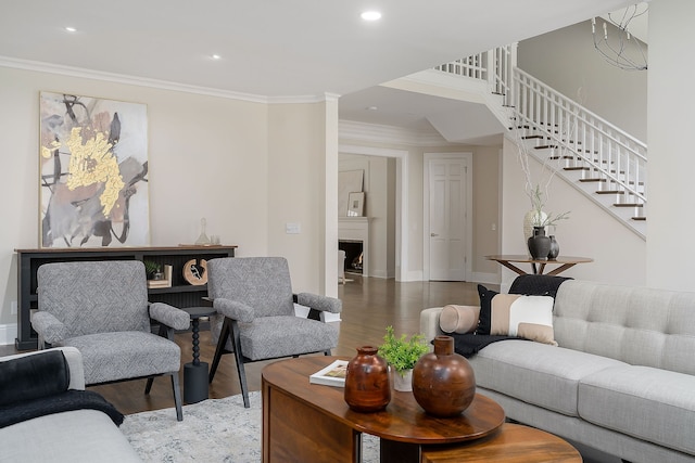 living room with hardwood / wood-style flooring and crown molding