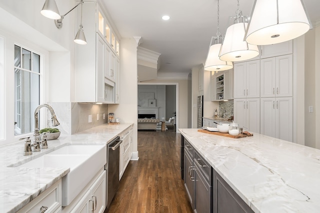 kitchen with pendant lighting, dishwasher, white cabinets, dark hardwood / wood-style floors, and tasteful backsplash