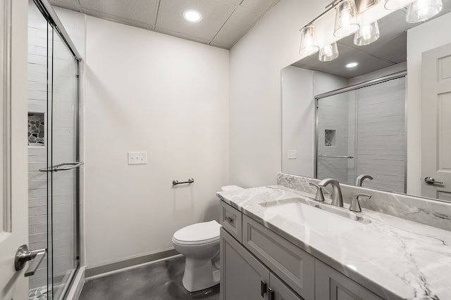 bathroom with vanity, toilet, concrete flooring, and walk in shower