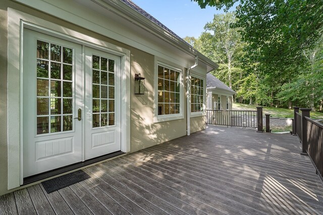 wooden terrace featuring french doors