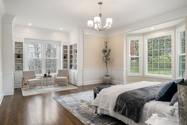 bedroom with multiple windows, a chandelier, dark wood-type flooring, and ornamental molding